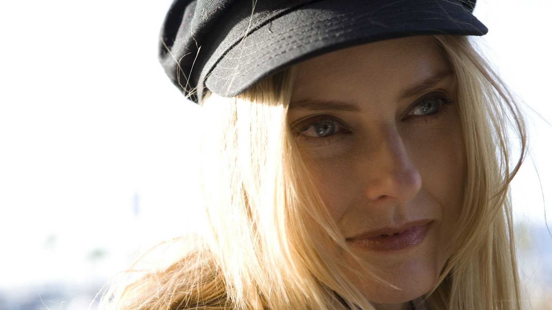 woman in black cap