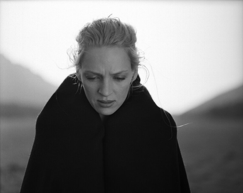 woman in black cloak outdoors