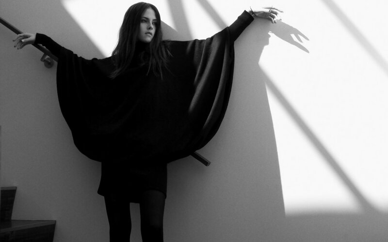 woman in black cloak