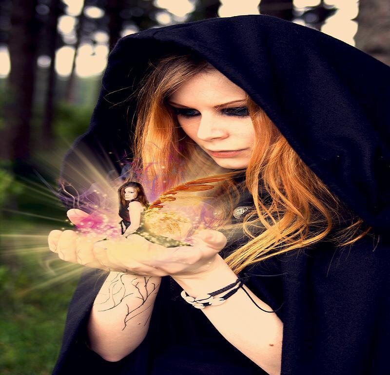 woman in black cloak with magic