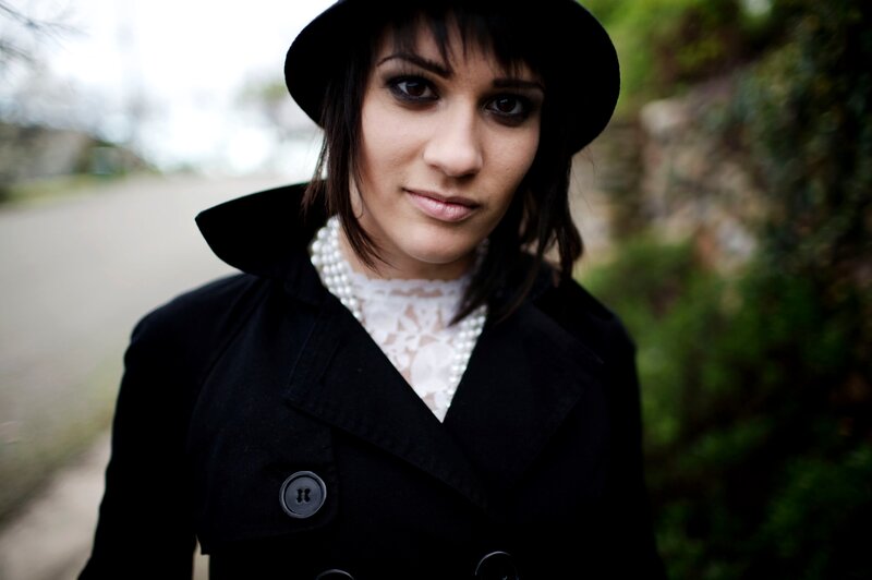 woman in black coat and hat