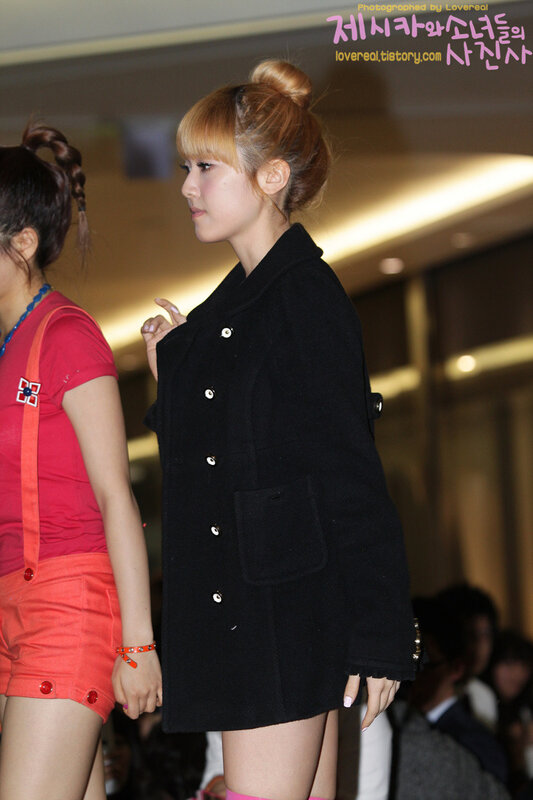 woman in black coat at event