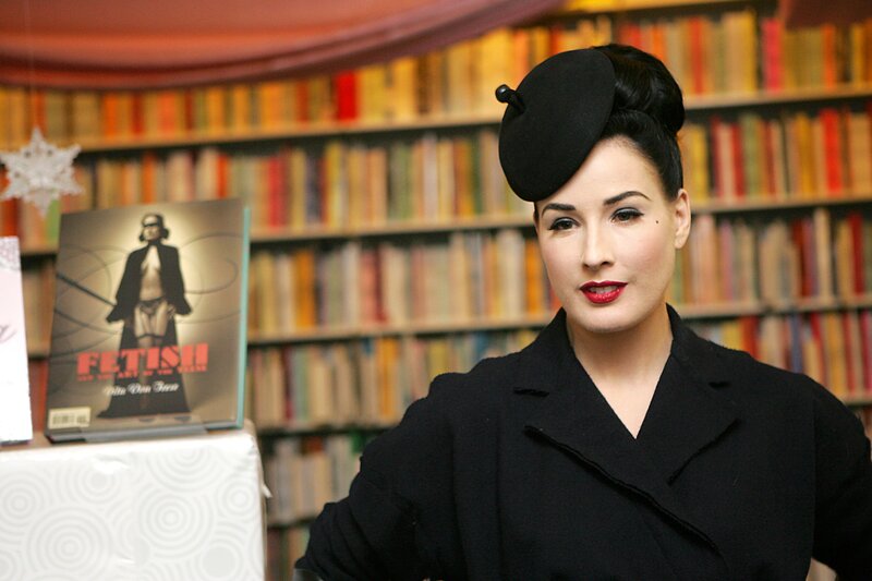 Woman in Black Coat — Confident, Photograph, Bookshelf