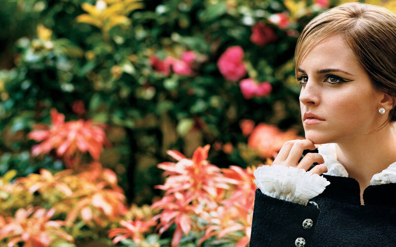 Woman in Black Coat — Contemplative, Photograph, Flowers