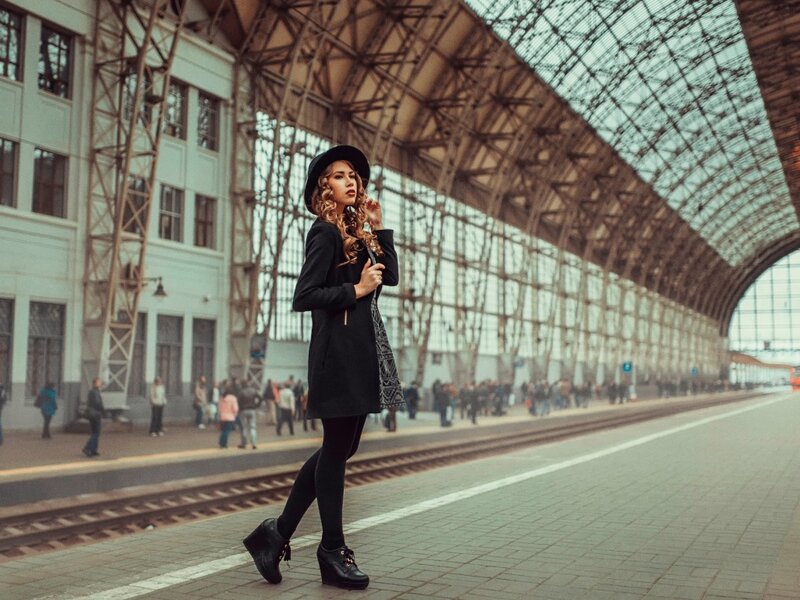 Woman in Black Coat — Dramatic, Afternoon, Photograph, Train Station