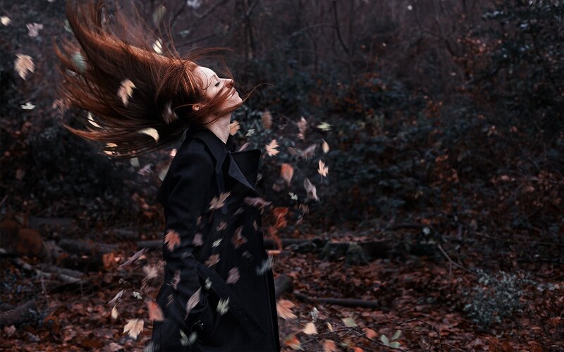 Woman in Black Coat — Dramatic, Autumn, Photograph, Falling Leaves
