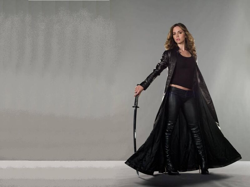Woman in Black Coat — Dramatic, Photograph, Sword