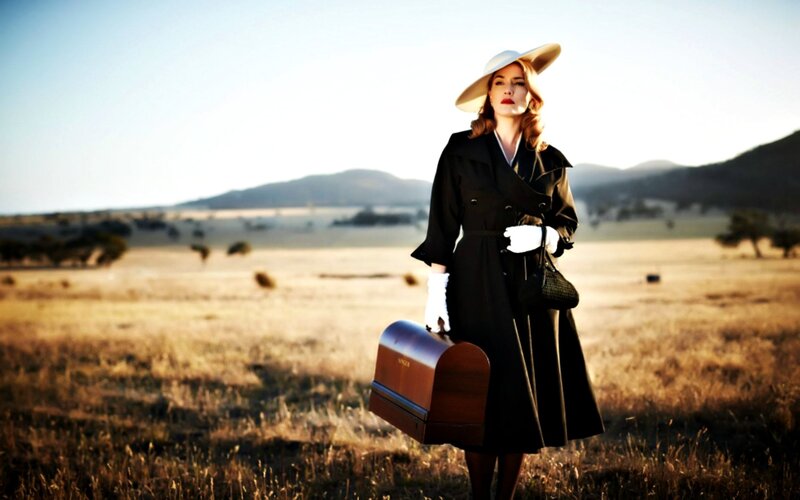 Woman in Black Coat — Dramatic, Sunset