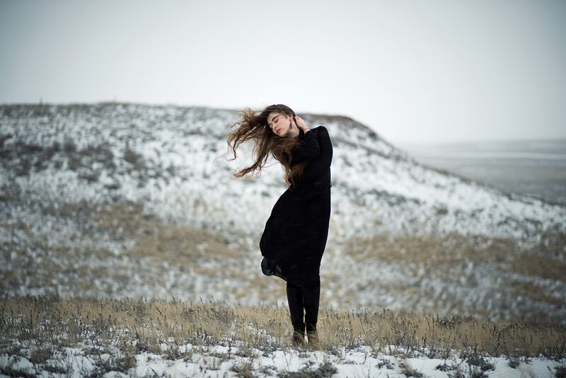Woman in Black Coat — Dramatic, Winter, Photograph, Snowy Hill