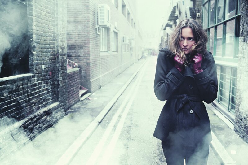 Woman in Black Coat — Gray, Dramatic