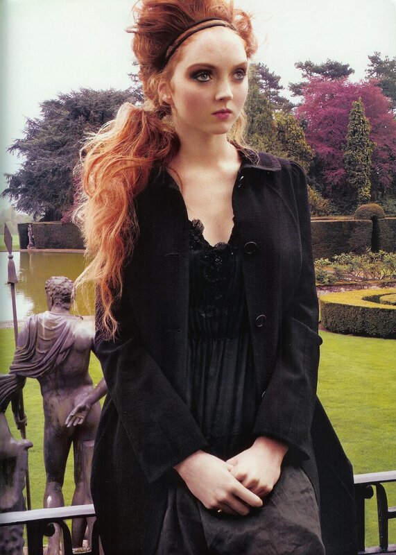 woman in black coat in garden