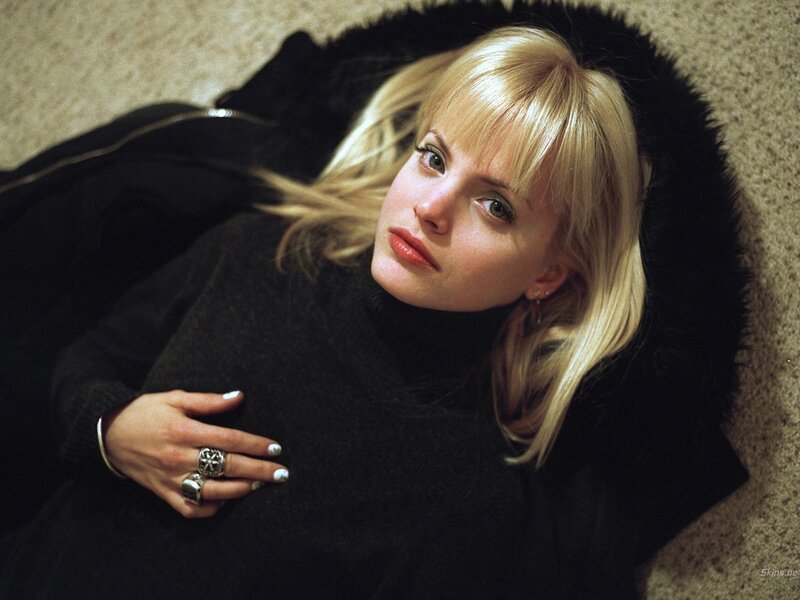 Woman in black coat lying down