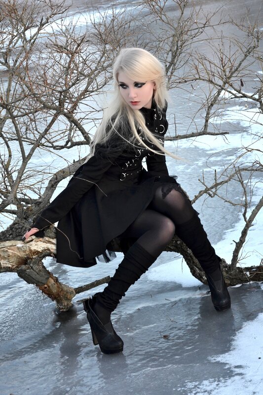Woman in black coat on ice