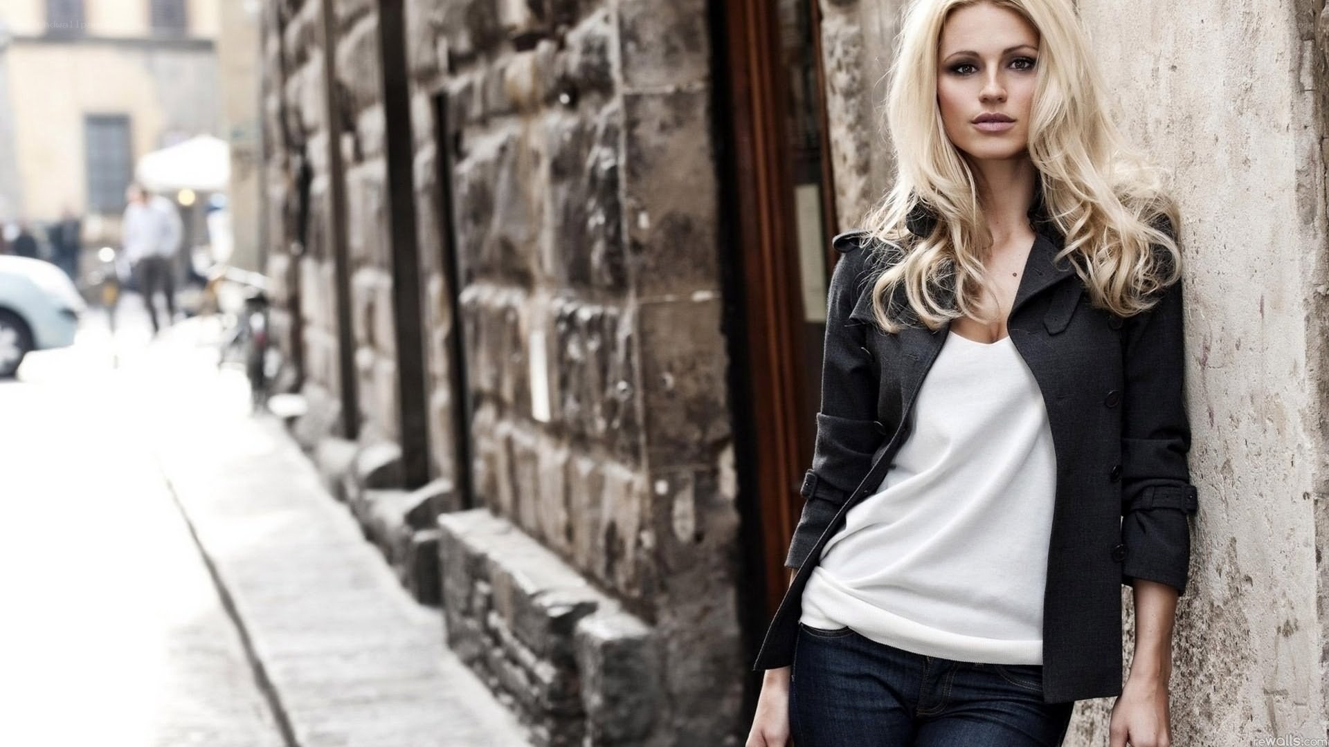 woman in black coat on street