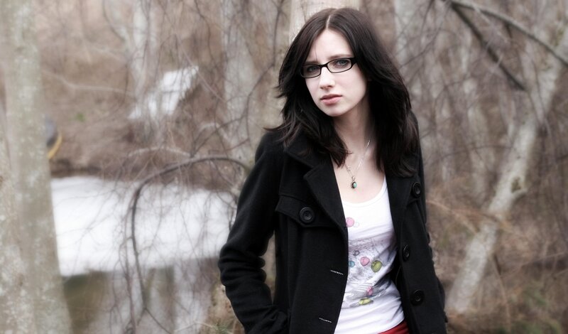 woman in black coat outdoors
