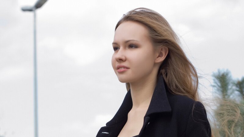 woman in black coat outdoors