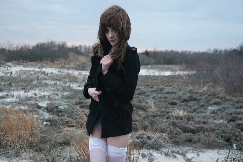 woman in black coat outdoors