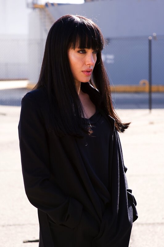 woman in black coat outdoors