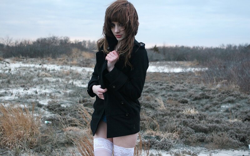 woman in black coat outdoors