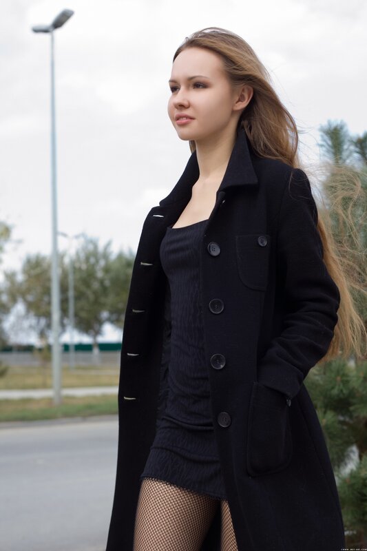 woman in black coat outdoors