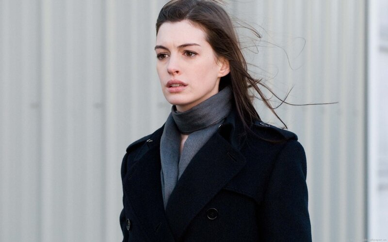 woman in black coat outdoors