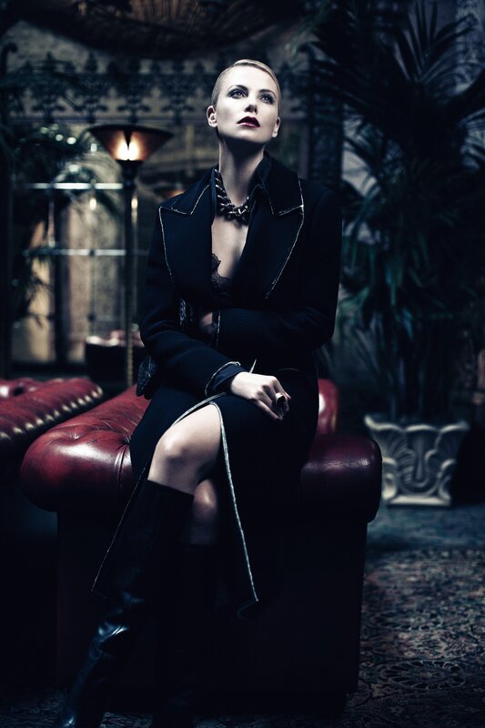 woman in black coat sitting