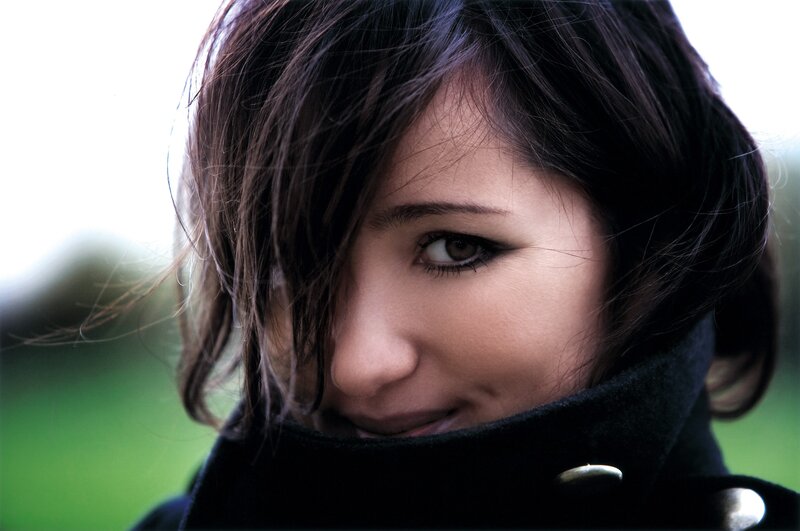 woman in black coat smiling