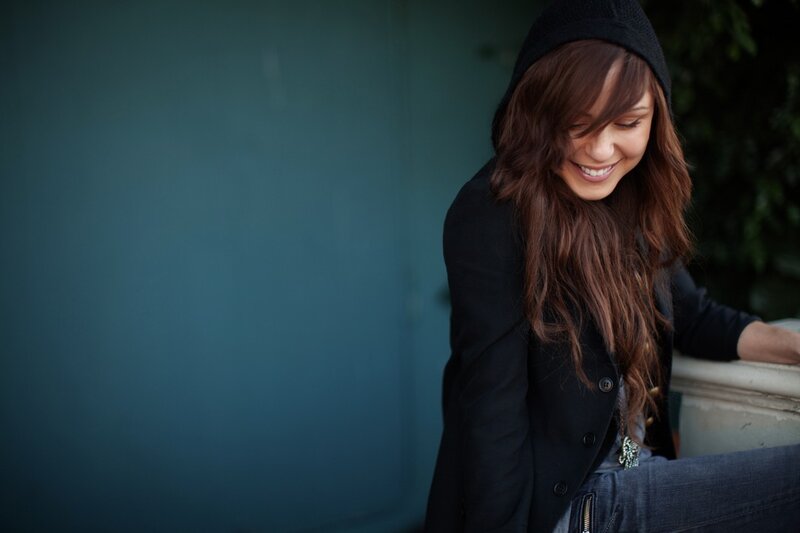 woman in black coat smiling