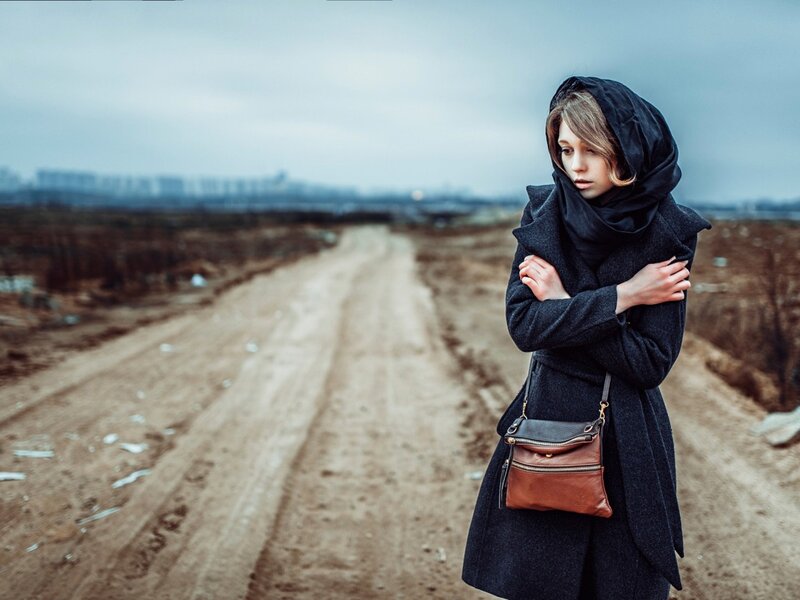 Woman in Black Coat — Somber