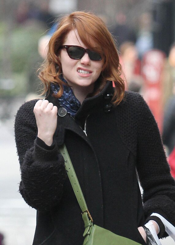 woman in black coat walking