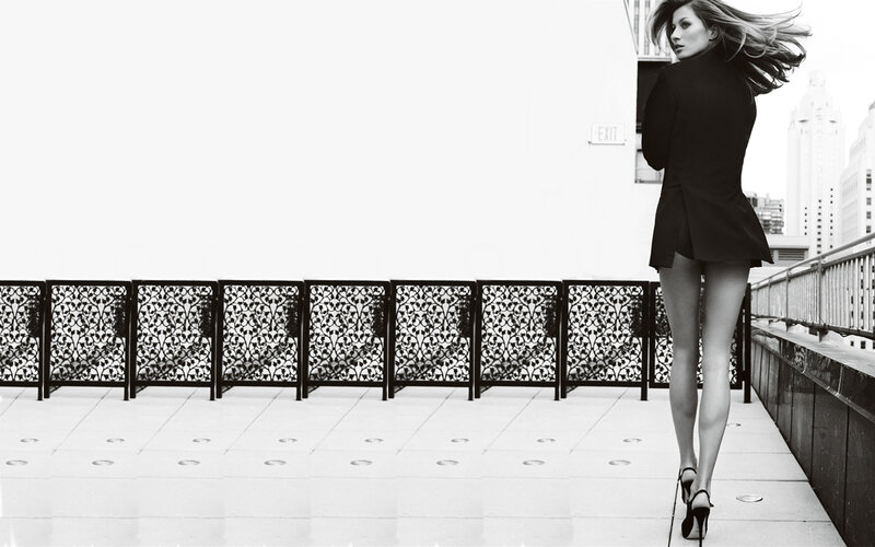 Woman in black coat walking