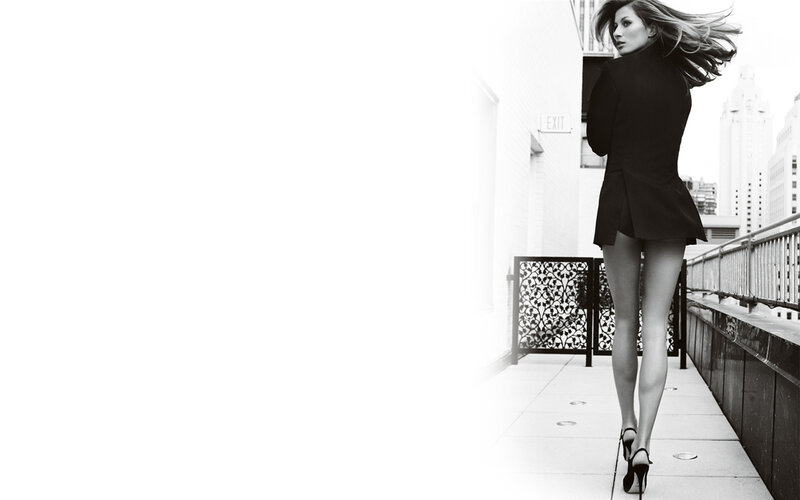 woman in black coat walking