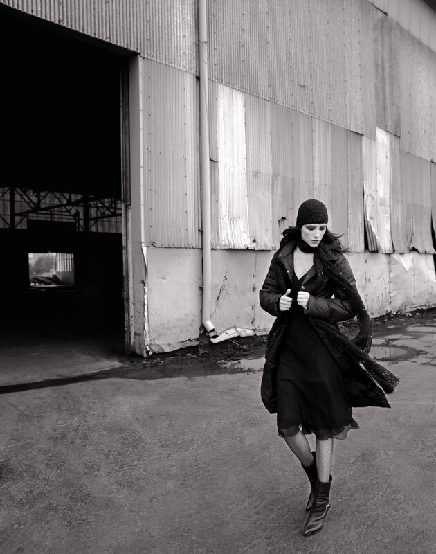 Woman in black coat walking