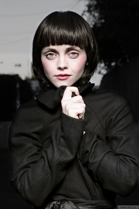 woman in black coat with bangs