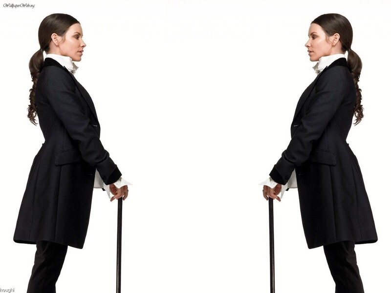 woman in black coat with cane