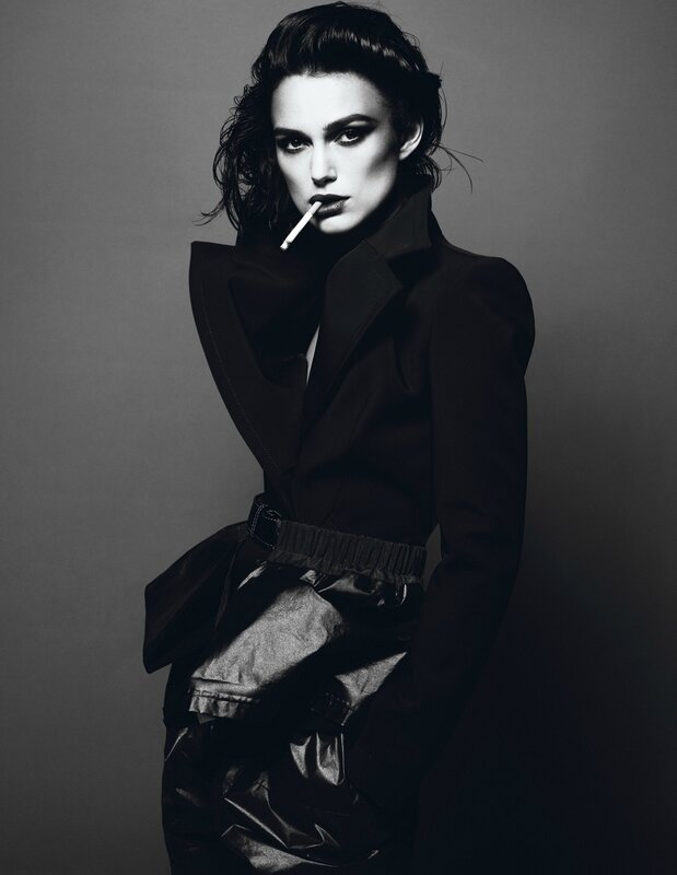 woman in black coat with cigarette