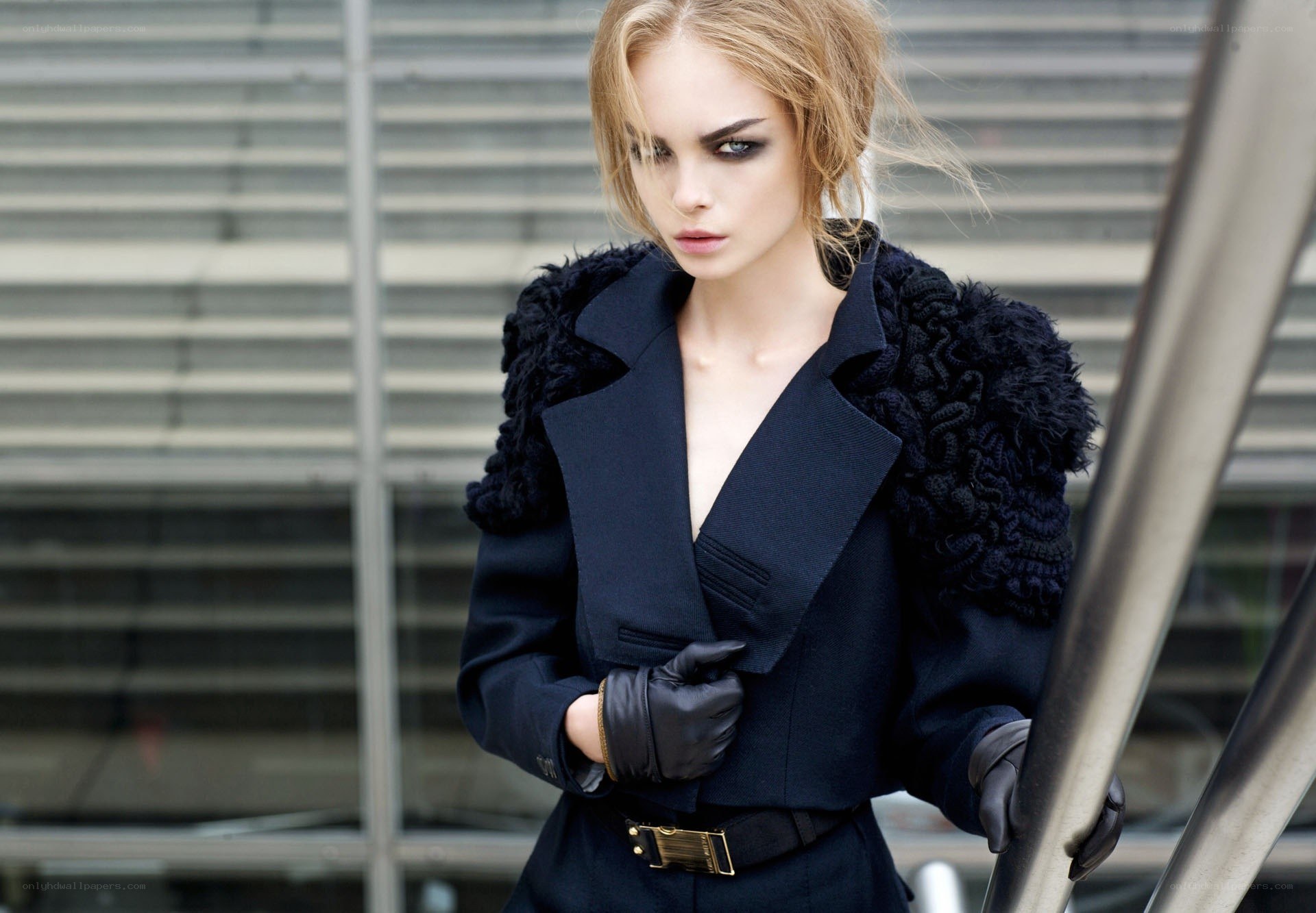 woman in black coat with dramatic makeup