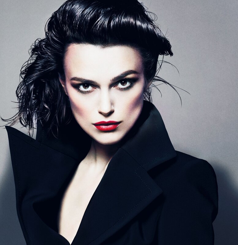 woman in black coat with red lipstick