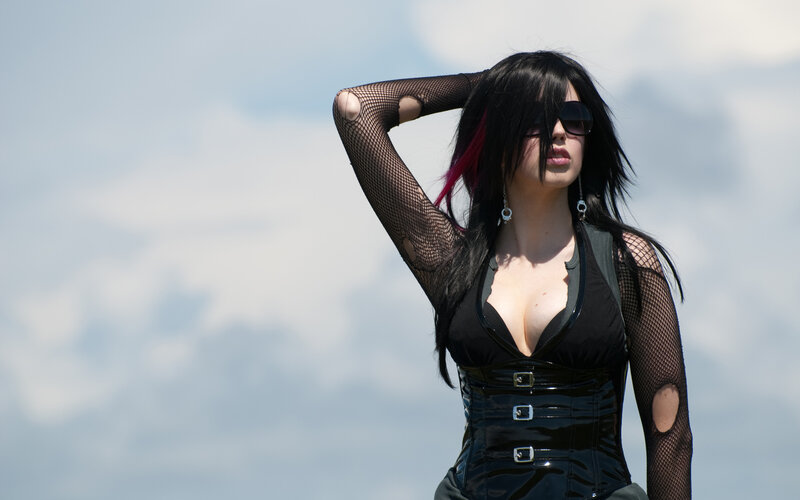 Woman in black corset and fishnet