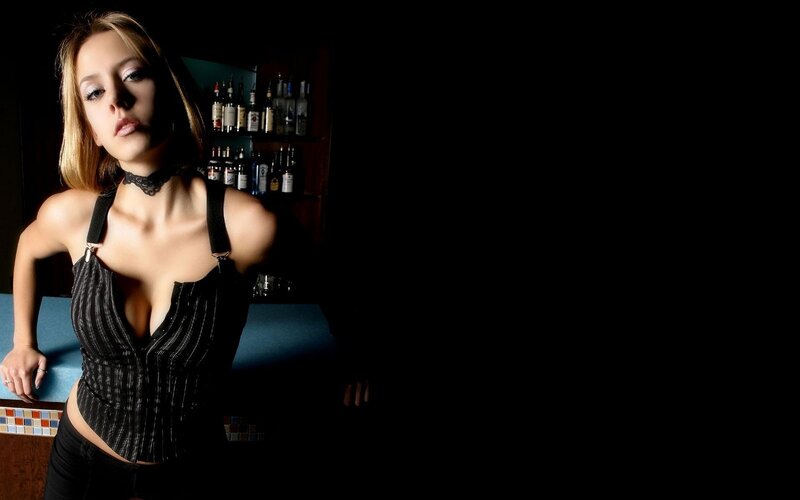 woman in black corset at bar