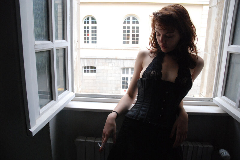 Woman in Black Corset — Contemplative