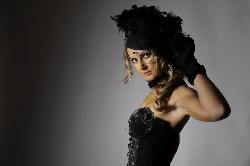 Woman in Black Corset — Dramatic, Photograph, Feather Hat