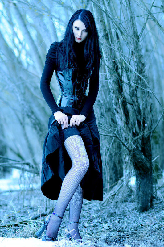 Woman in black corset outdoors