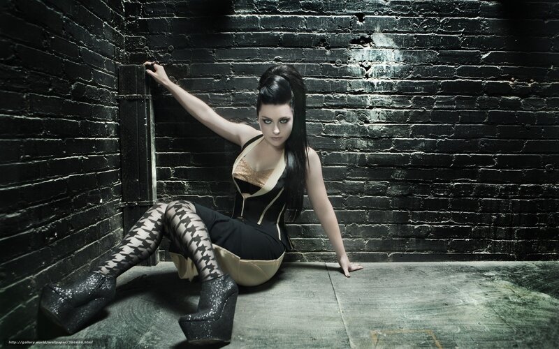 woman in black corset sitting