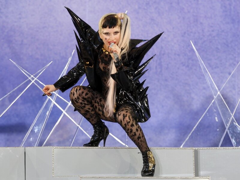 Woman in Black Costume — Dramatic, Photograph, Microphone