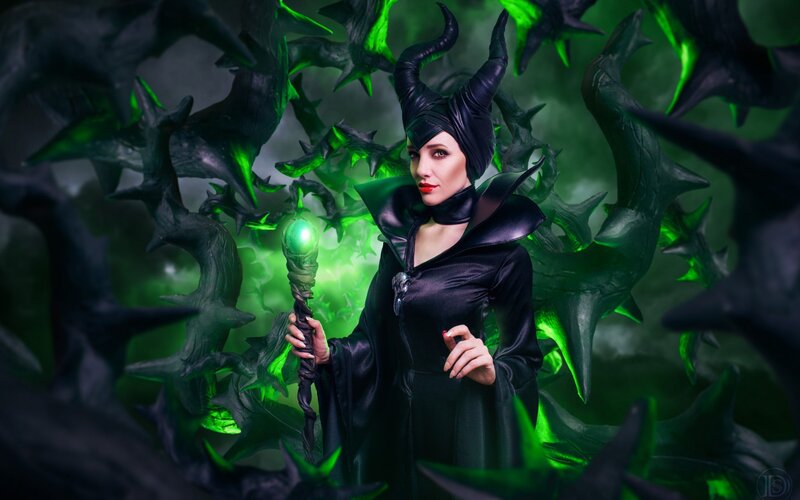 Woman in Black Costume — Dramatic, Photograph, Staff, Horns