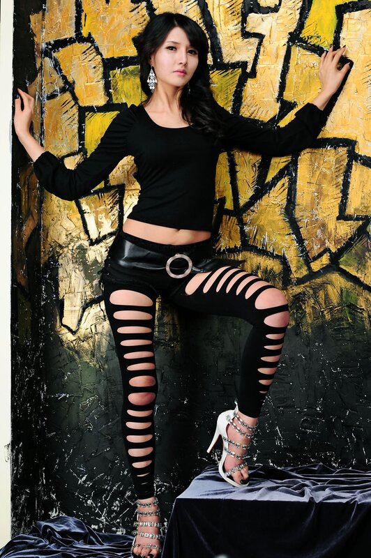 woman in black cutout leggings