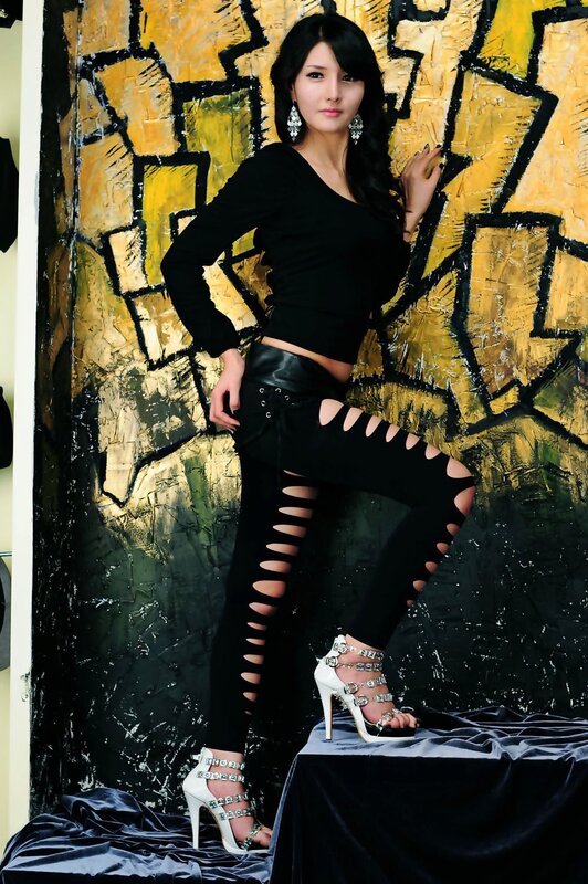 woman in black cutout pants