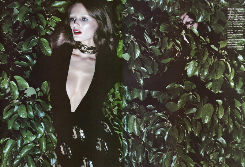 woman in black dress among leaves