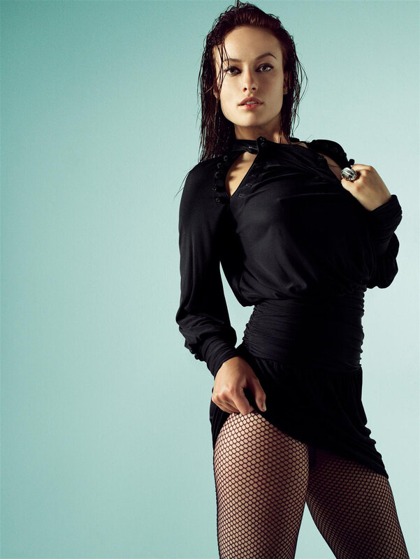 woman in black dress and fishnet tights